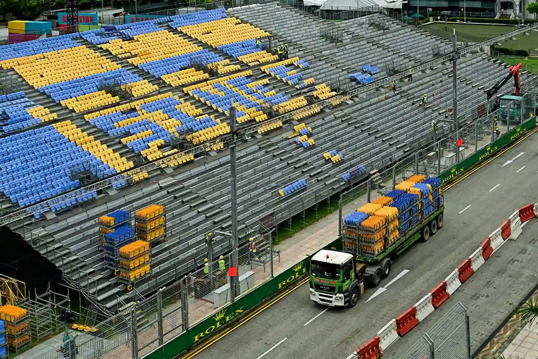 Workers dismantling temporary Singapore Grand Prix infrastructure after the race