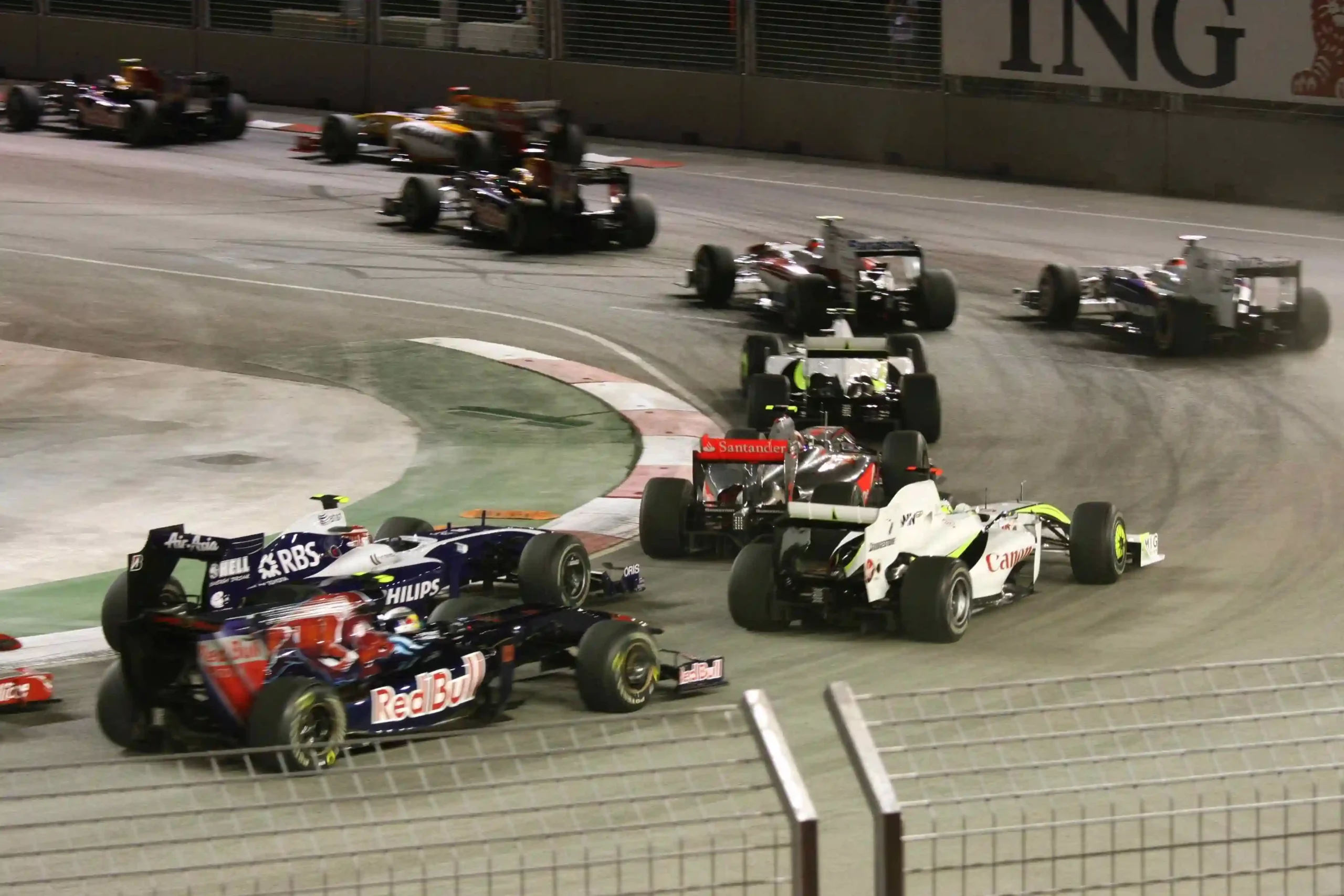 Formula 1 cars launching under floodlights at the start of the 2009 Singapore Grand Prix