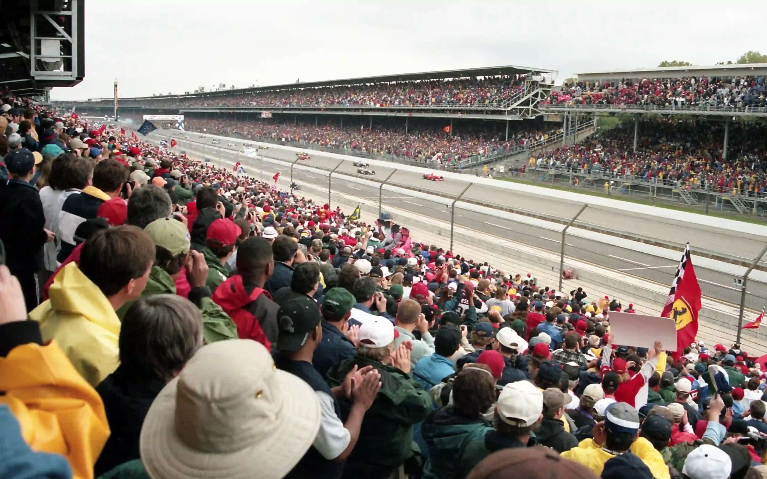 Formula 1 cars accelerating from the grid at the 2000 United States Grand Prix in Indianapolis