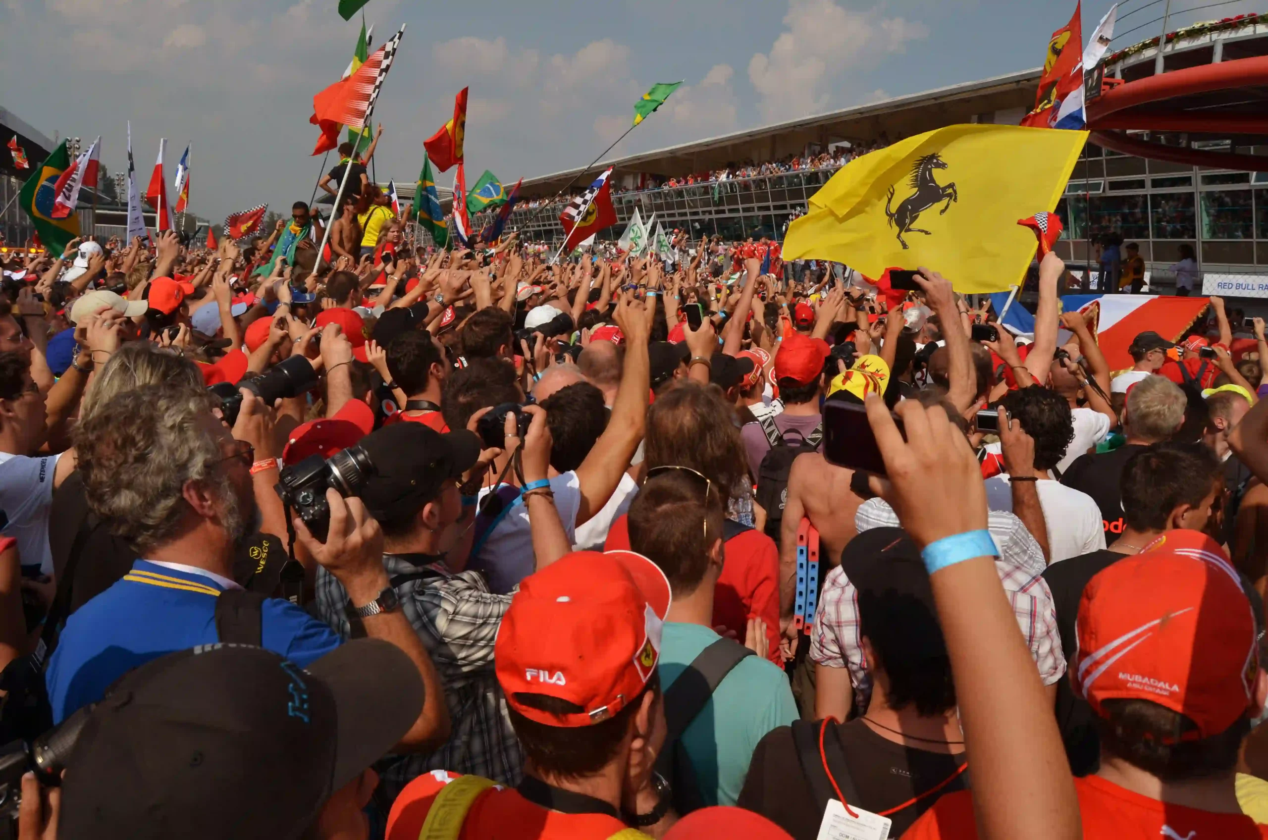 Ferrari supporters gathered beneath the Monza podium after the 2011 Italian Grand Prix
