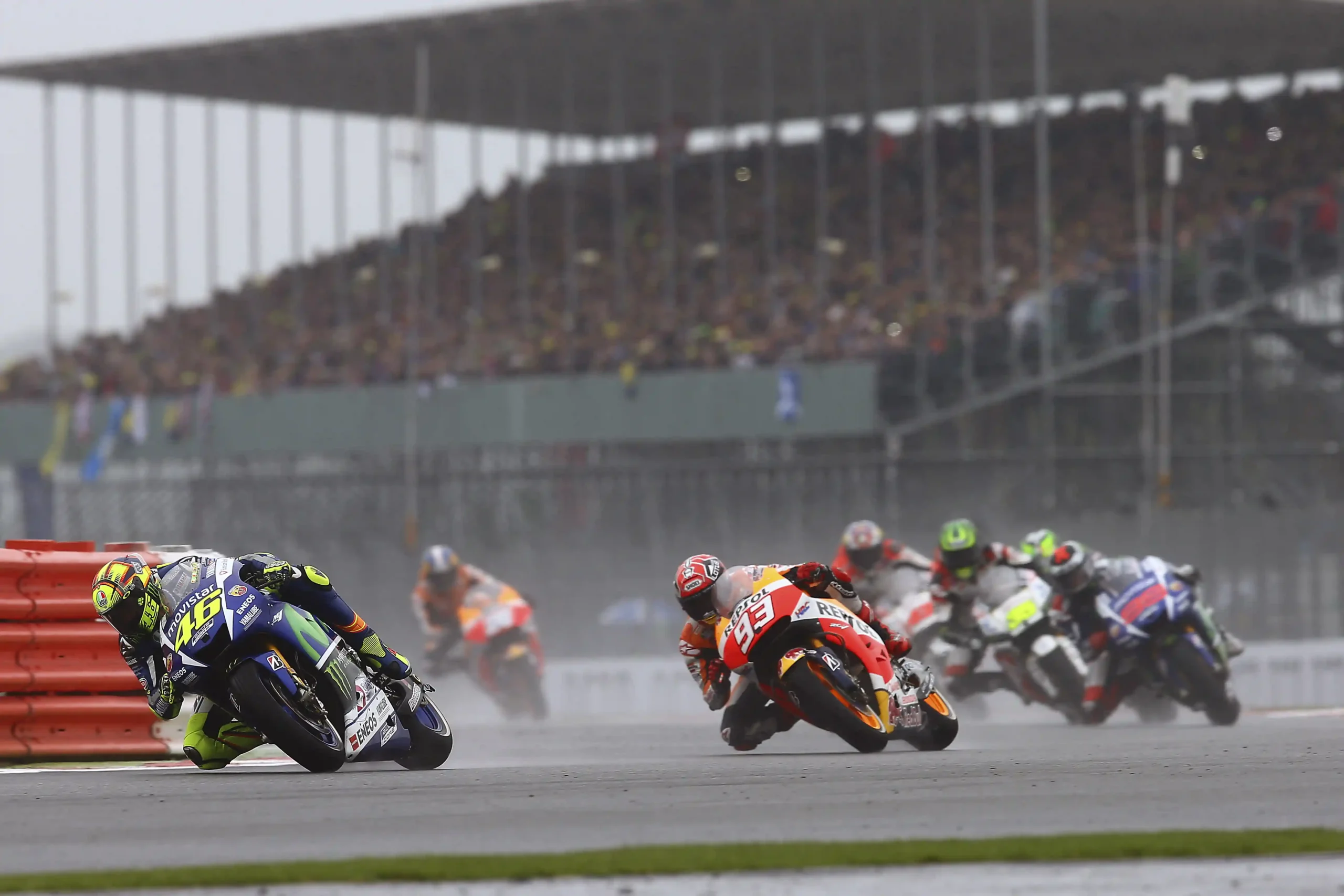 Valentino Rossi leading a MotoGP group during the wet 2015 British Grand Prix at Silverstone