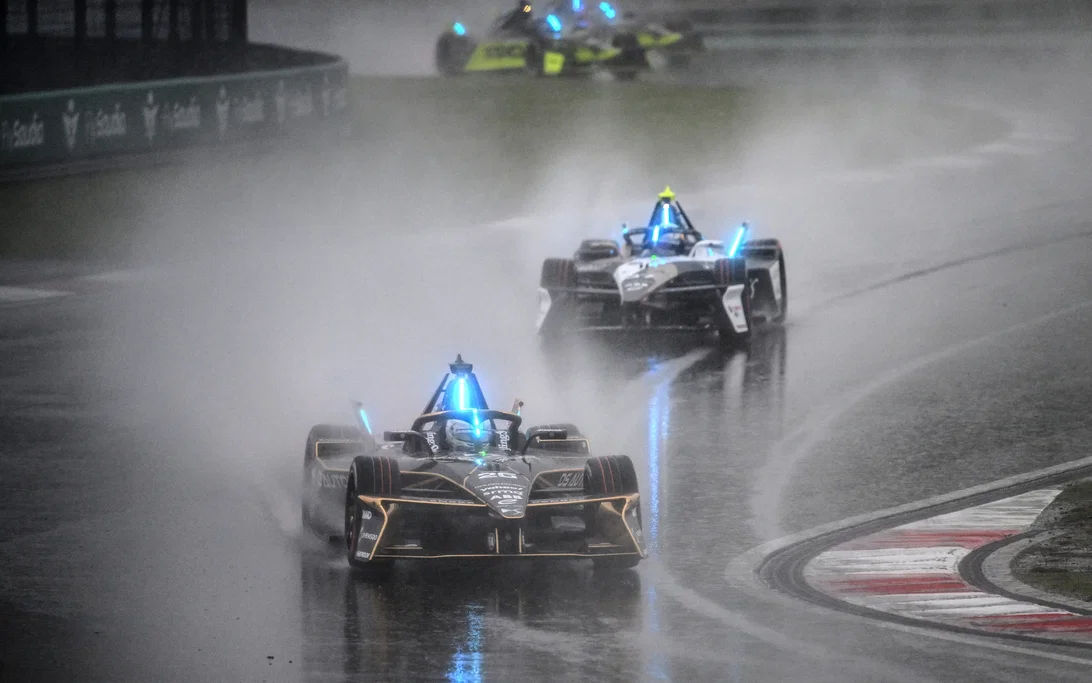 Formula E electric racing car at speed through wet conditions — characteristic of the 2026 Shanghai E-Prix double-header