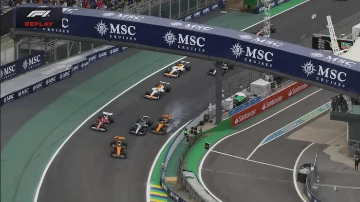 Formula 2 cars racing wheel to wheel down the Hangar Straight at Silverstone during the 2026 Sprint Race
