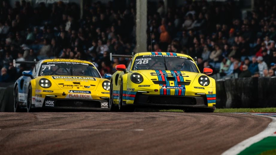 Porsche Carrera Cup Great Britain cars cresting the track at Thruxton