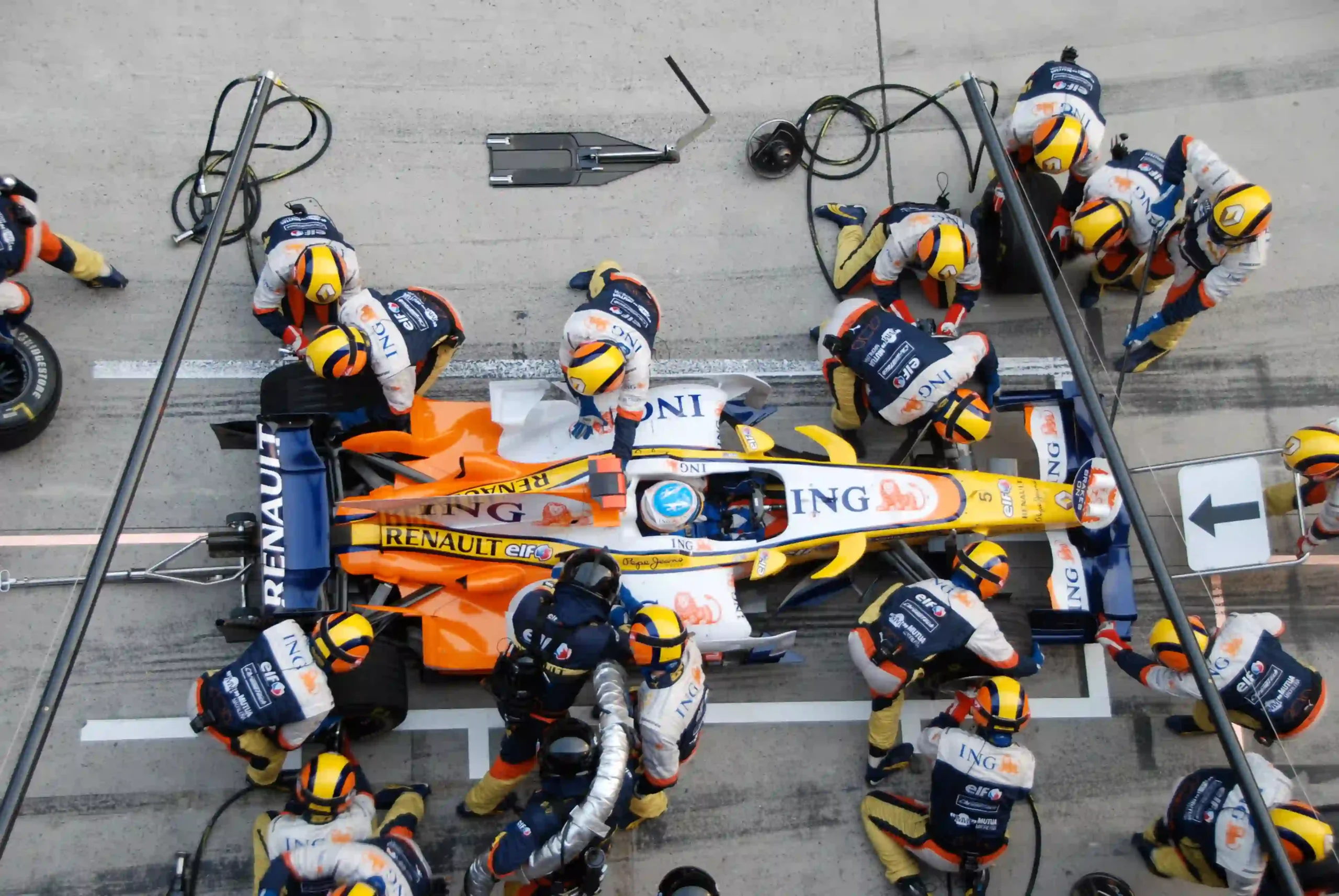 Renault Formula 1 pit crew servicing Fernando Alonso during the 2008 Chinese Grand Prix