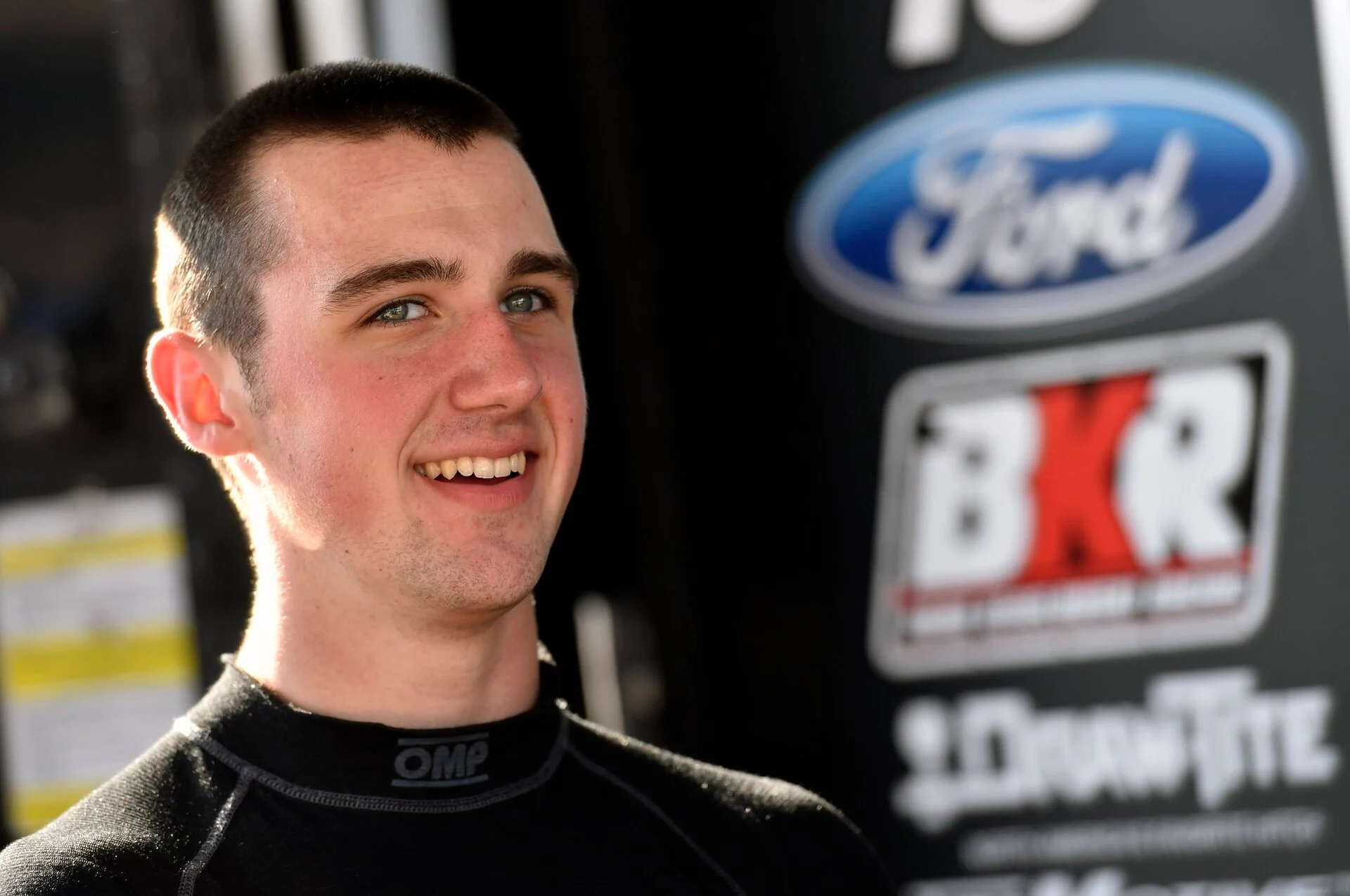 NASCAR driver Austin Cindric outside a race hauler at Iowa Speedway