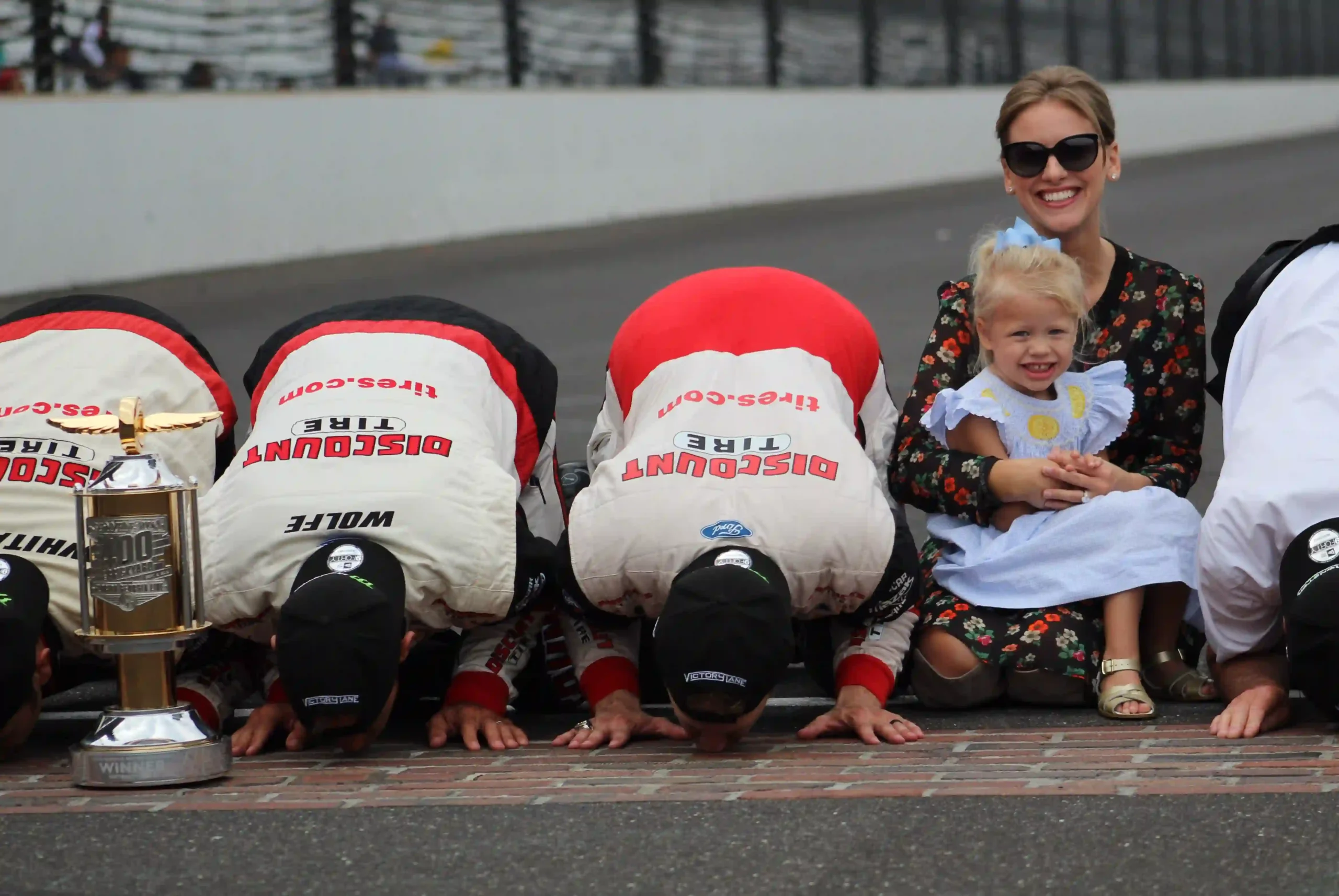 Brad Keselowski kisses the yard of bricks after a Brickyard 400 victory