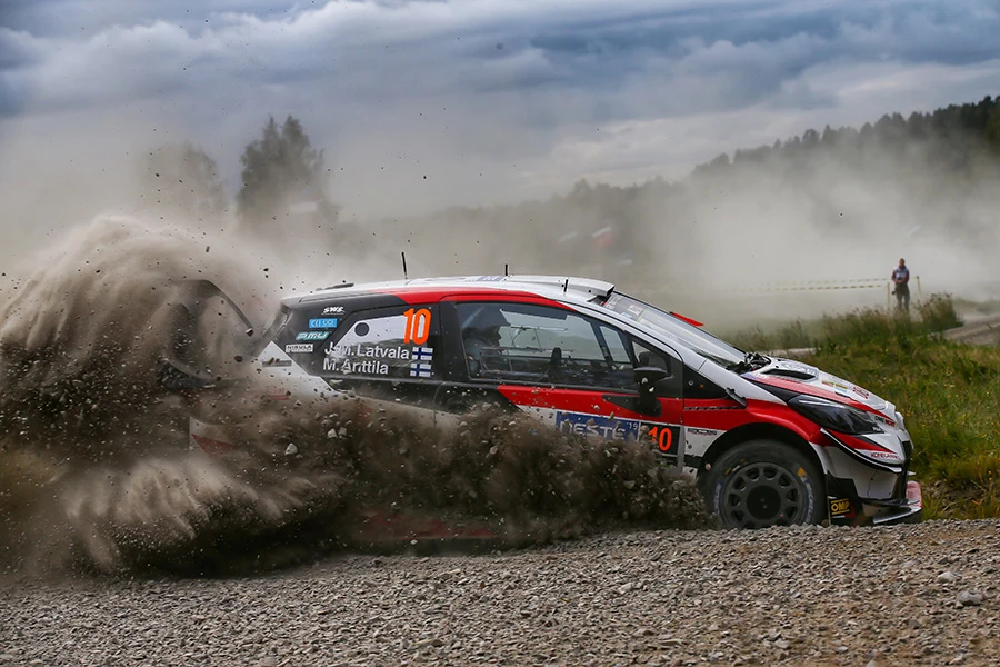 Toyota rally car throwing gravel during Rally Finland action