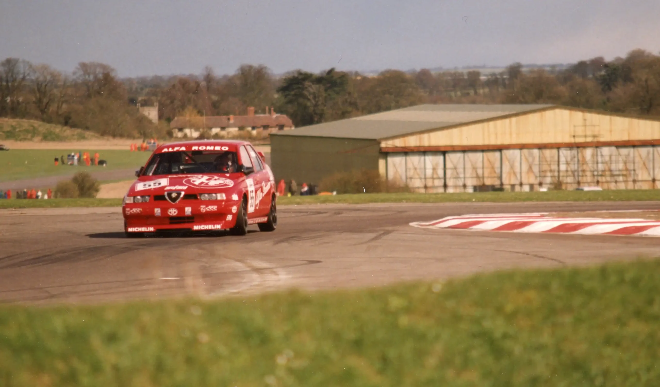 Gabriele Tarquini racing an Alfa Romeo 155 in the 1994 BTCC at Thruxton
