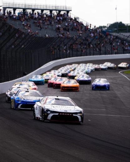 Denny Hamlin leads the NASCAR Cup Series field during the 2026 Brickyard 400