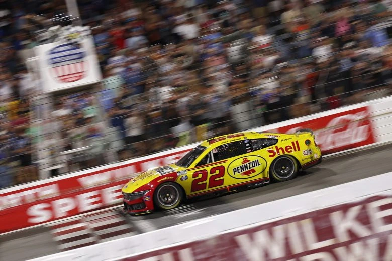 Joey Logano takes the checkered flag at the 2026 Window World 450