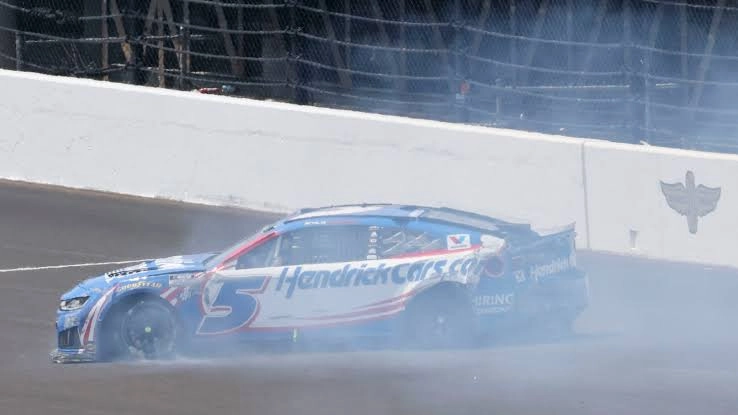 Kyle Larson's damaged No. 5 Chevrolet being taken toward the garage after his Stage 1 crash in the 2026 Brickyard 400