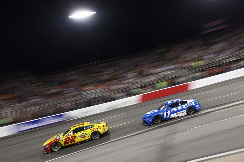 Joey Logano and Denny Hamlin race for position at North Wilkesboro Speedway