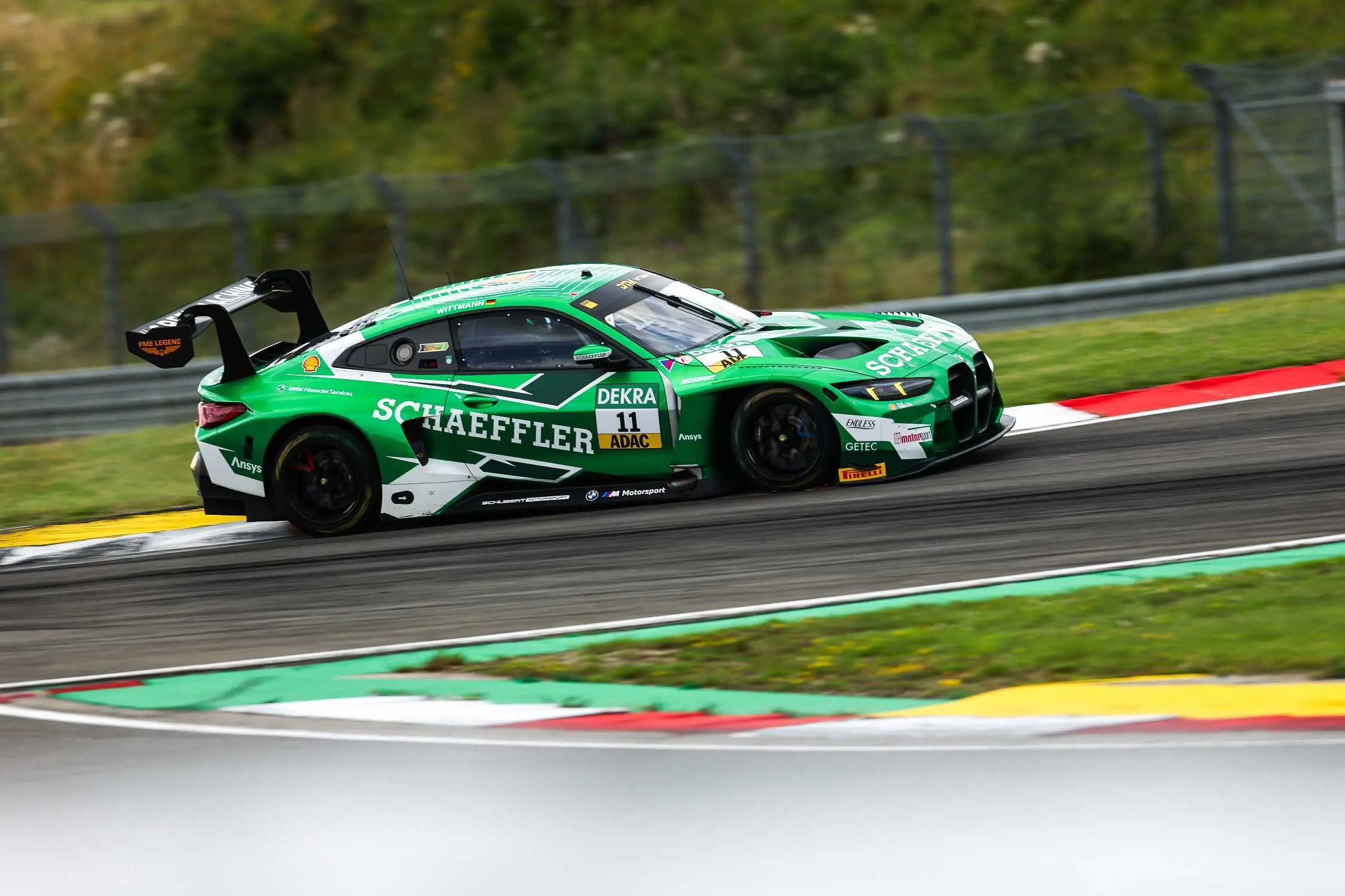 BMW M4 GT3 Evo at speed on the Nürburgring circuit
