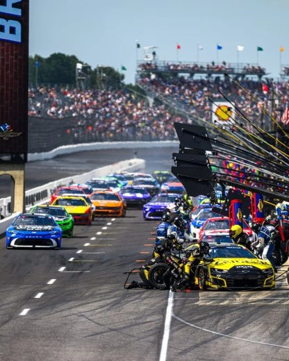 NASCAR Cup Series teams service cars on pit road during the 2026 Brickyard 400