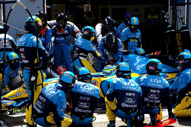 Renault Formula 1 pit crew servicing Giancarlo Fisichella during the 2005 British Grand Prix