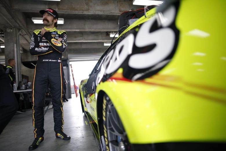 Ryan Blaney talks with his team before Brickyard 400 practice at Indianapolis Motor Speedway