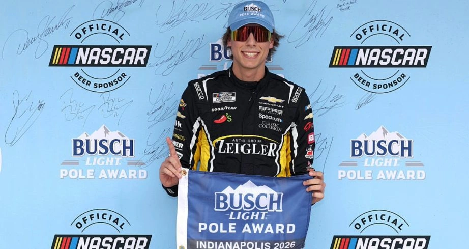 Carson Hocevar celebrates the 2026 Brickyard 400 pole at Indianapolis Motor Speedway