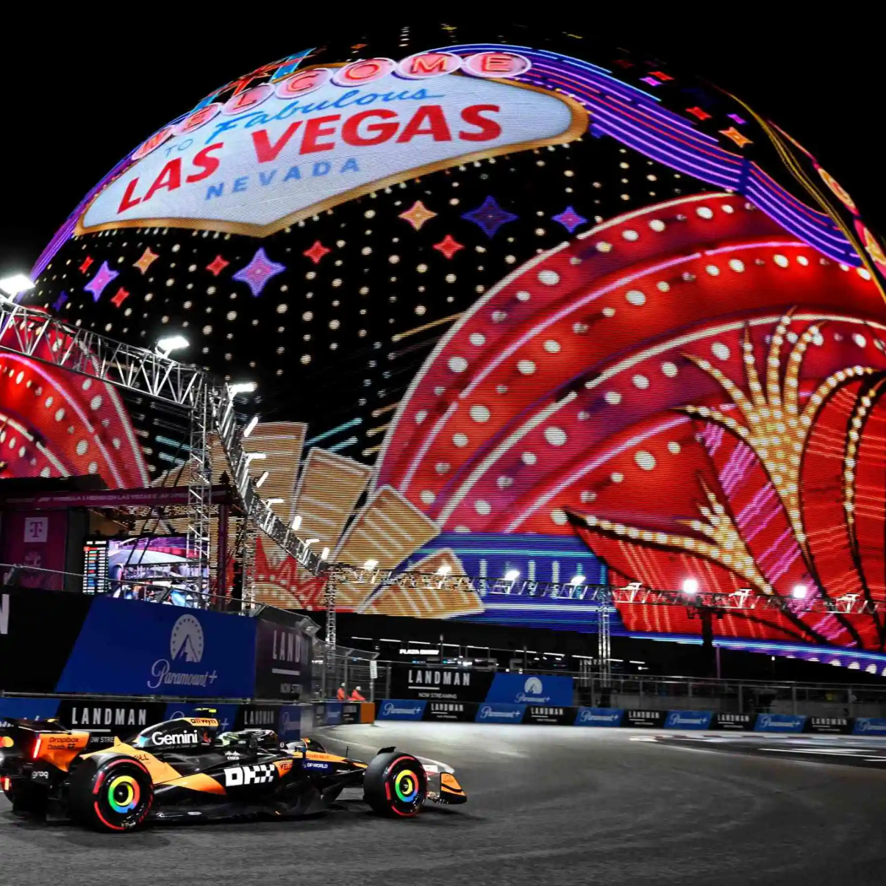 Formula 1 cars racing at night on the Las Vegas Strip during the Saturday-night Las Vegas Grand Prix